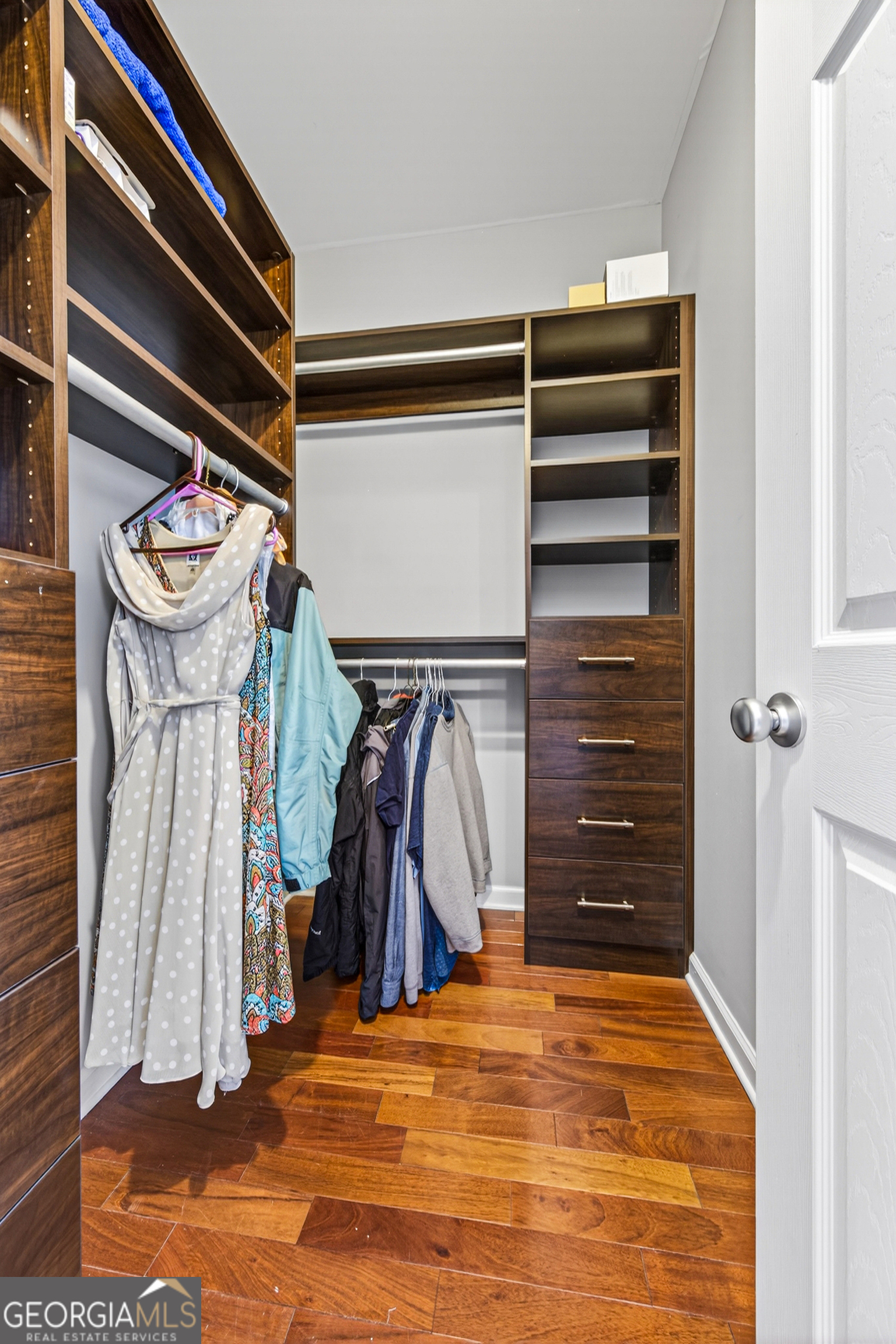 1071 Louden Ridge Road Alto, GA 30510 - Photo 26 of 81 a view of walk in closet with clothes and shoes