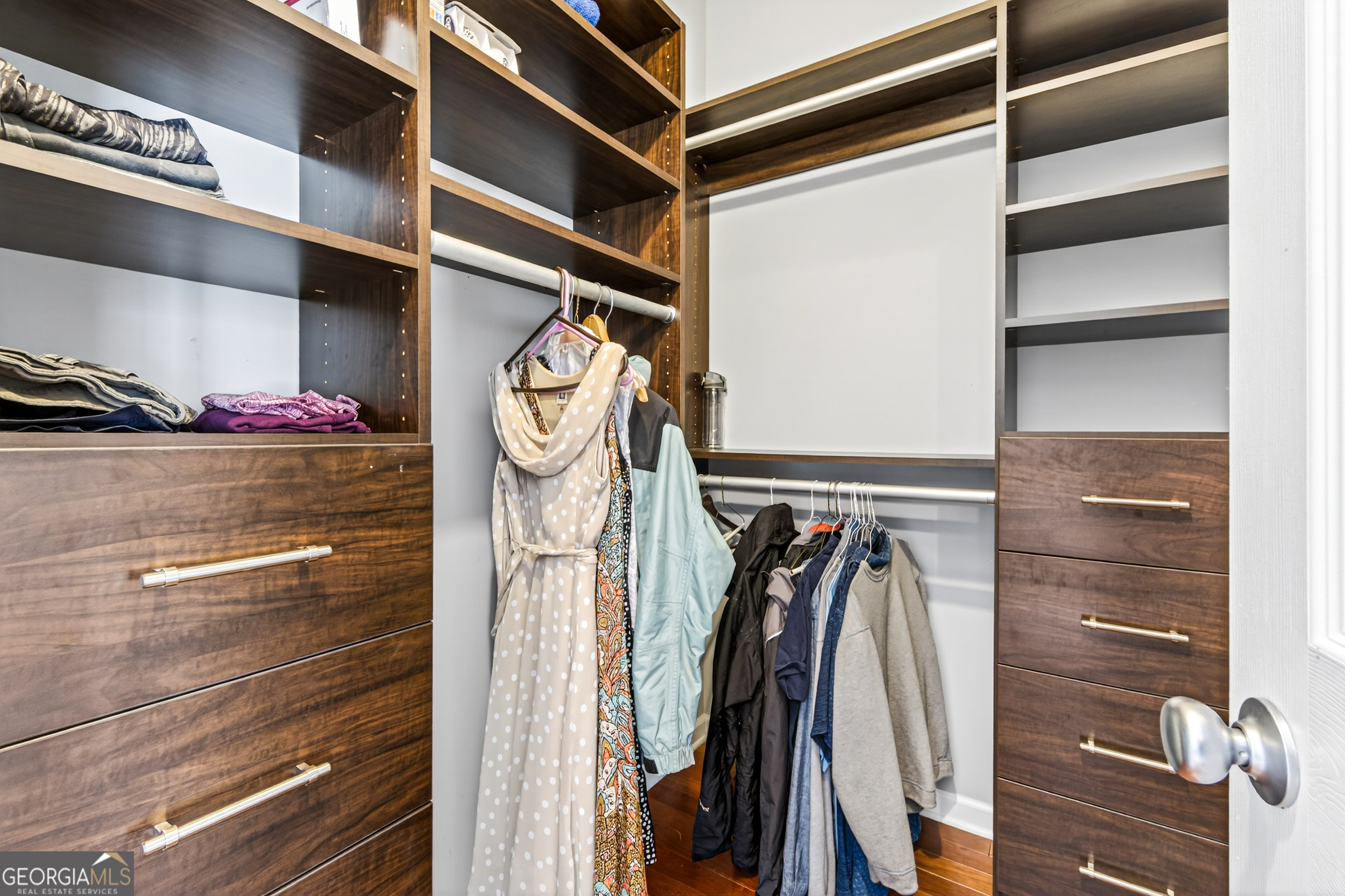 1071 Louden Ridge Road Alto, GA 30510 - Photo 27 of 81 a view of walk in closet with clothes and shoes