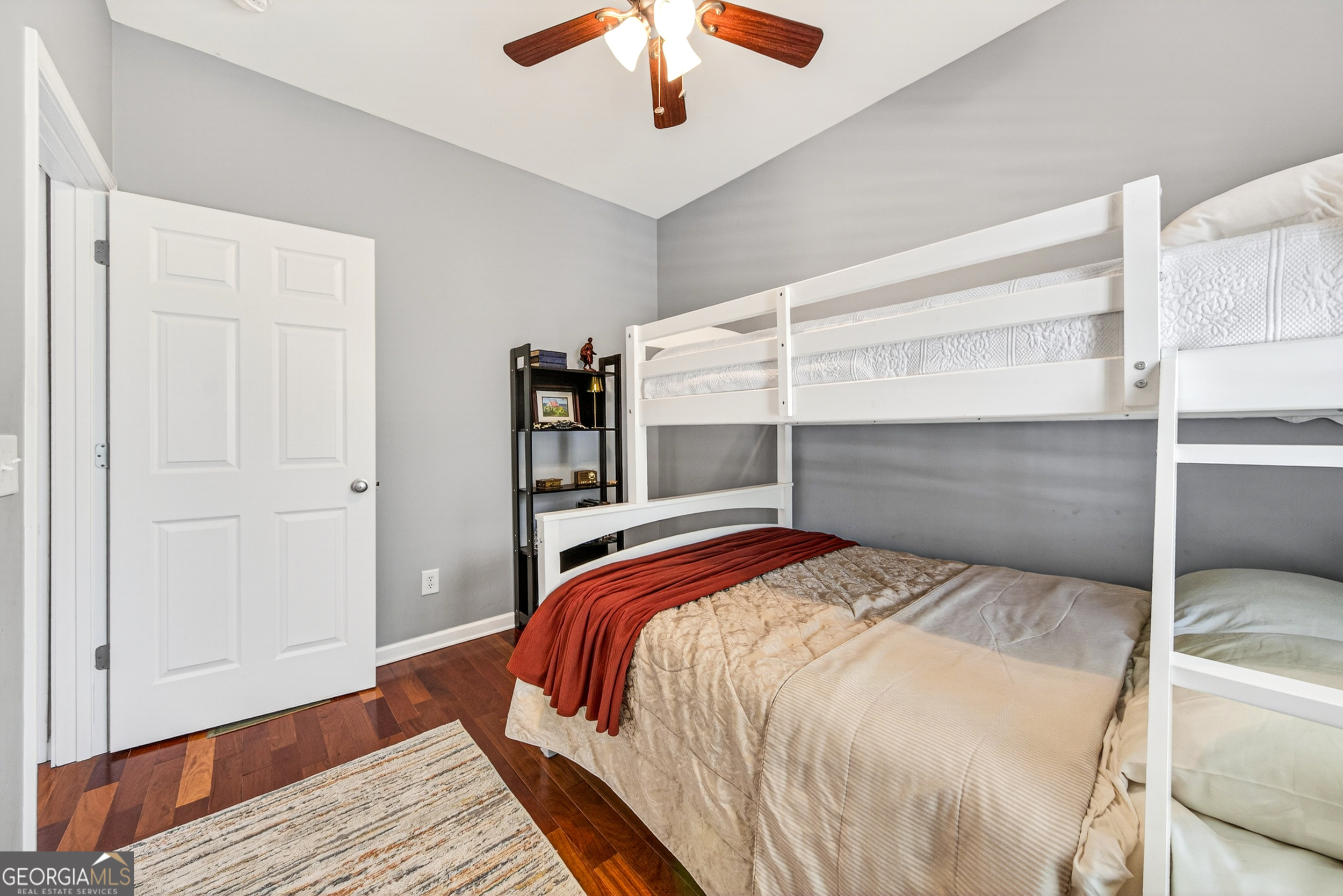 1071 Louden Ridge Road Alto, GA 30510 - Photo 31 of 81 a bedroom with a bed and a chandelier