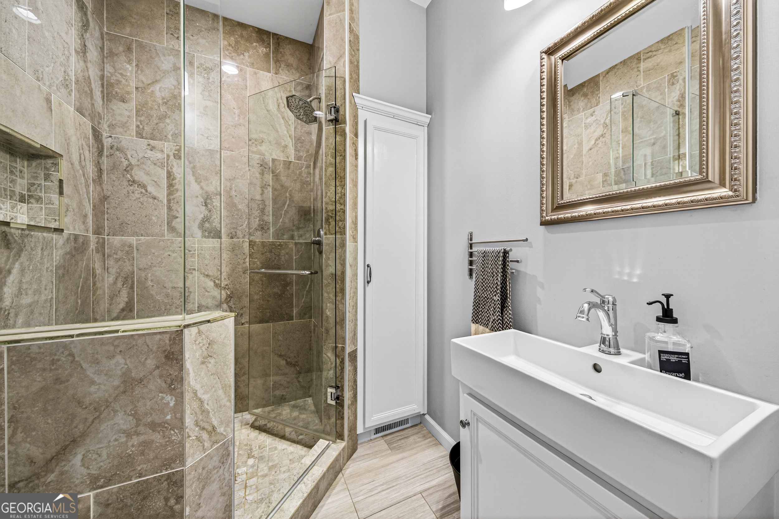 1071 Louden Ridge Road Alto, GA 30510 - Photo 33 of 81 a bathroom with a sink and a mirror