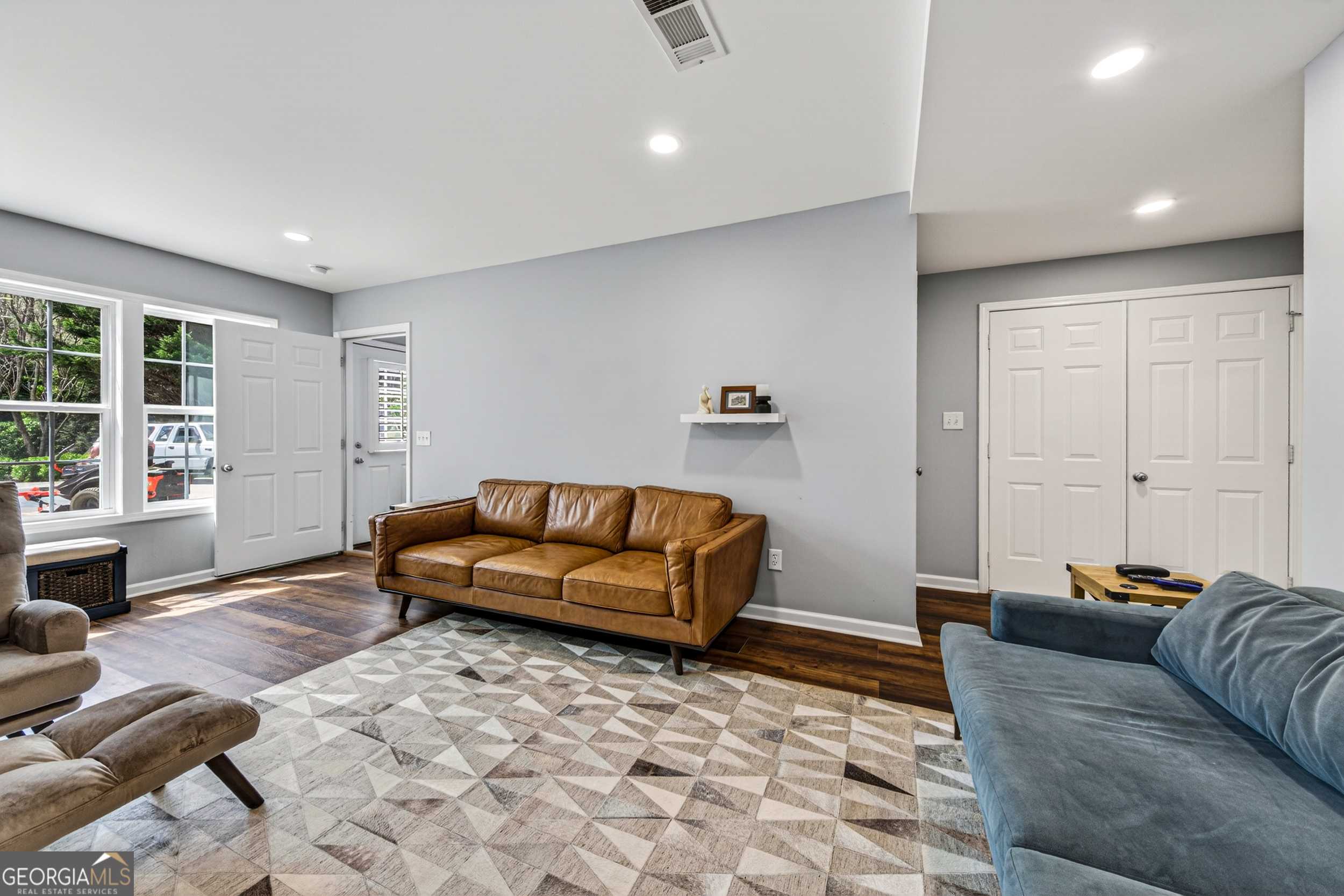 1071 Louden Ridge Road Alto, GA 30510 - Photo 4 of 81 a living room with couches and kitchen view with wooden floor