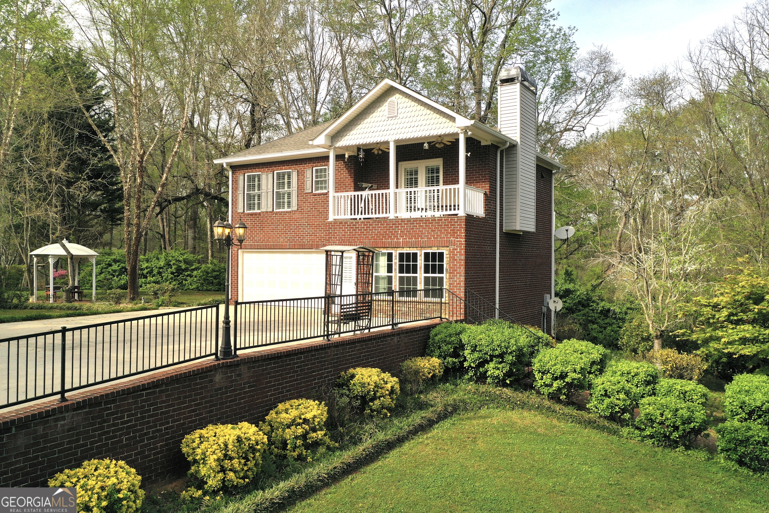 1071 Louden Ridge Road Alto, GA 30510 - Photo 55 of 81 a front view of a house with a yard and a garden