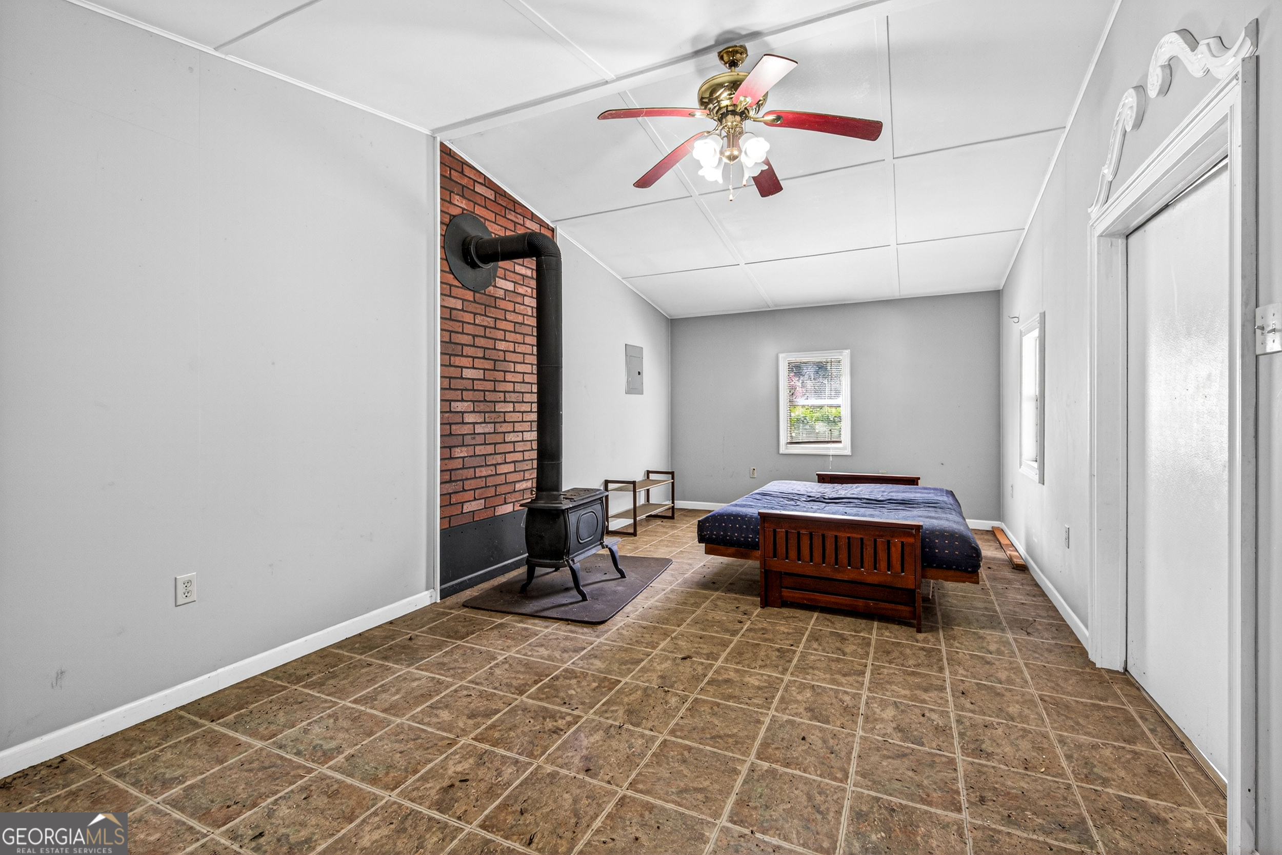 1071 Louden Ridge Road Alto, GA 30510 - Photo 57 of 81 a living room with a bed and a chandelier