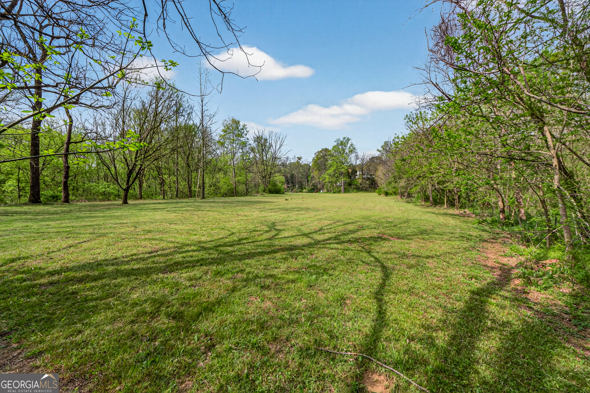 1071 Louden Ridge Road Alto, GA 30510 - Photo 77 of 81 a grassy field with trees in the background