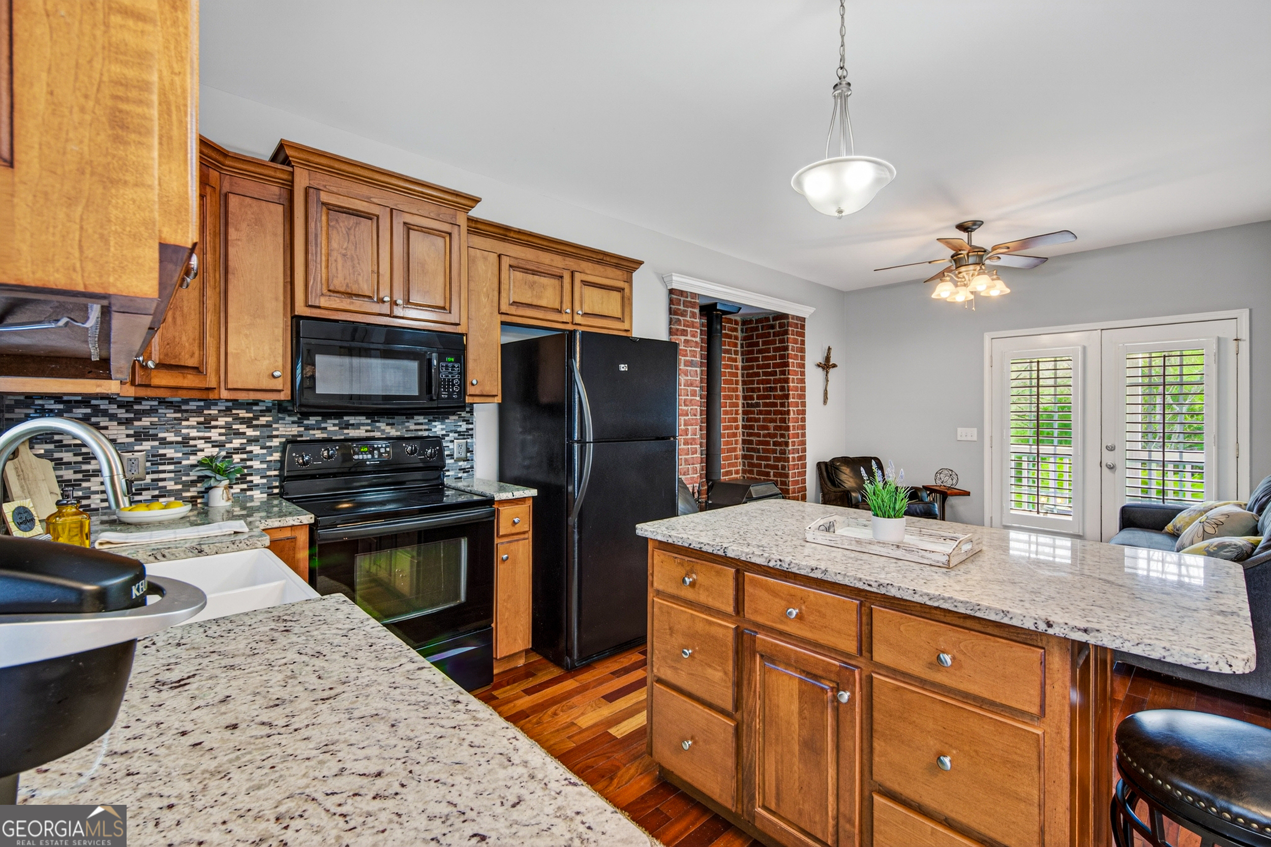 1071 Louden Ridge Road Alto, GA 30510 - Photo 9 of 81 a kitchen with stainless steel appliances granite countertop a sink stove and refrigerator