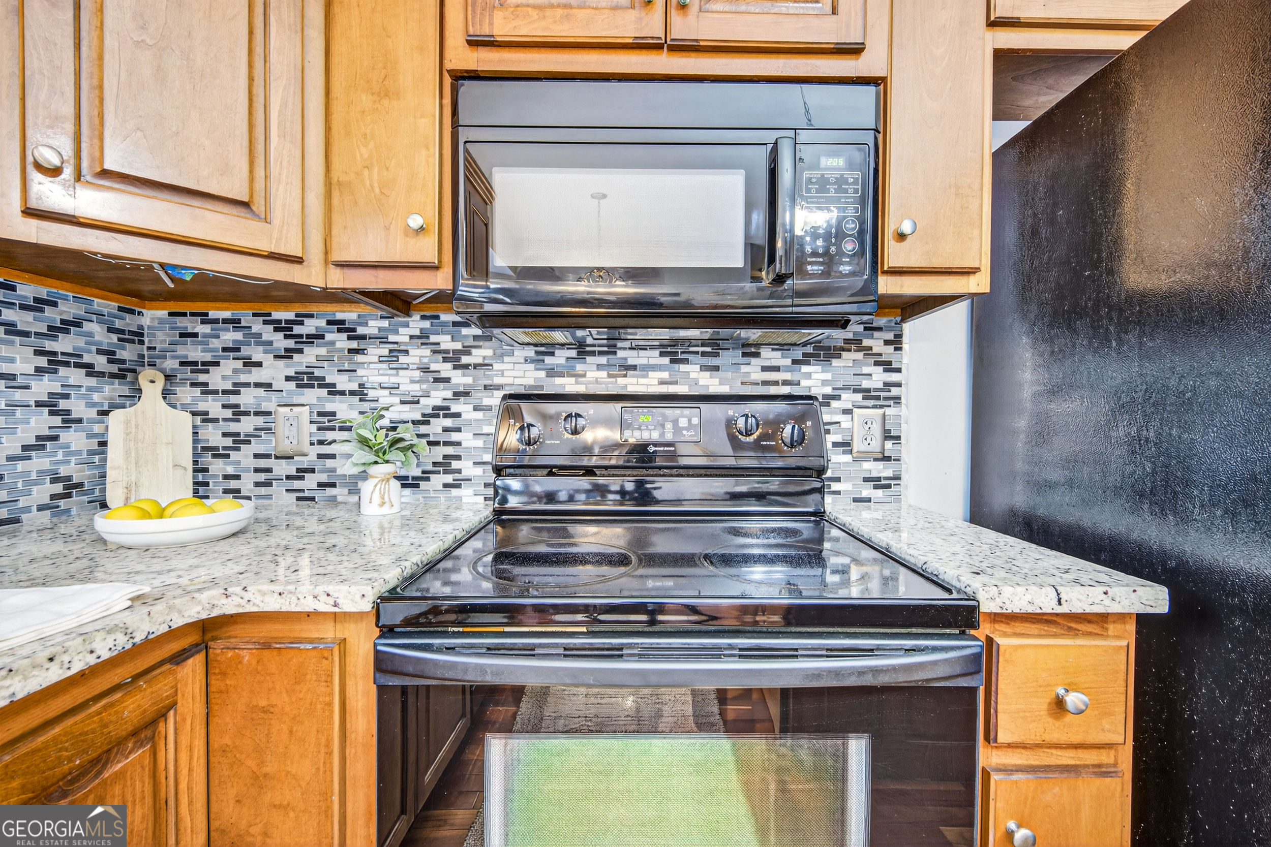 1071 Louden Ridge Road Alto, GA 30510 - Photo 10 of 81 a stove top oven sitting inside of a kitchen