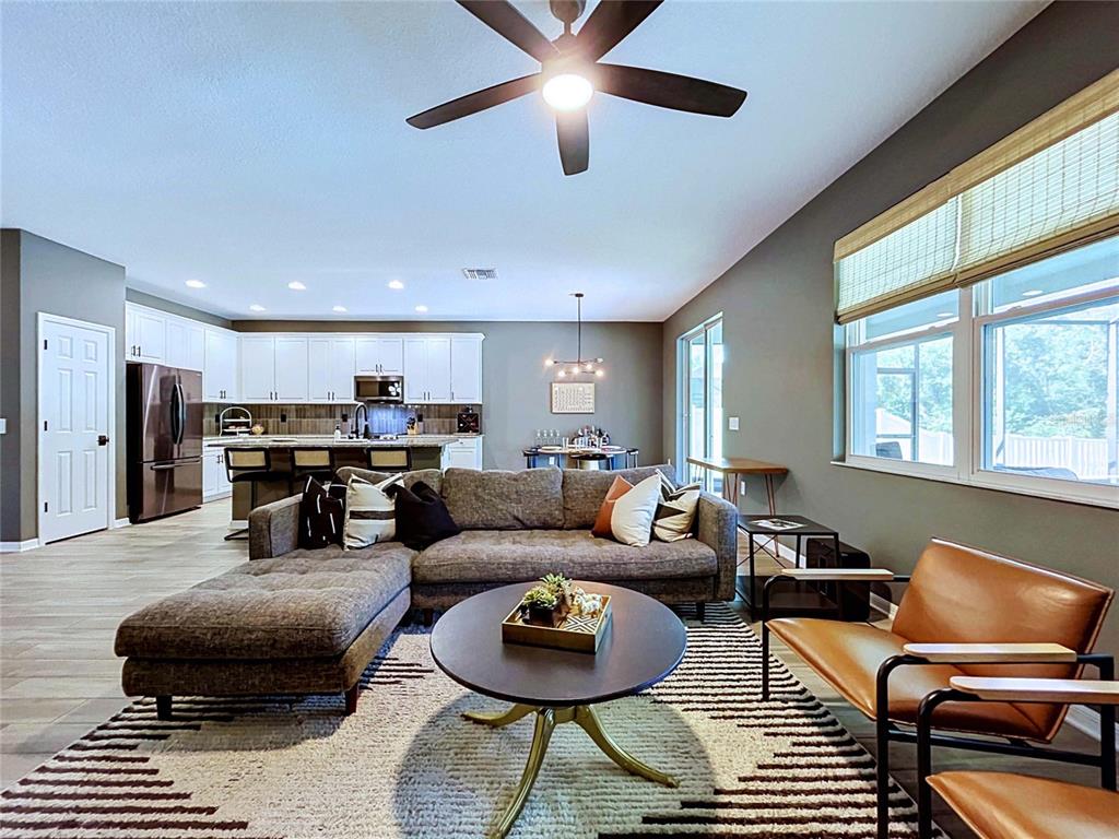 18078 Romanesque Court Spring Hill, FL 34610 - Photo 21 of 81 a living room with furniture and a window