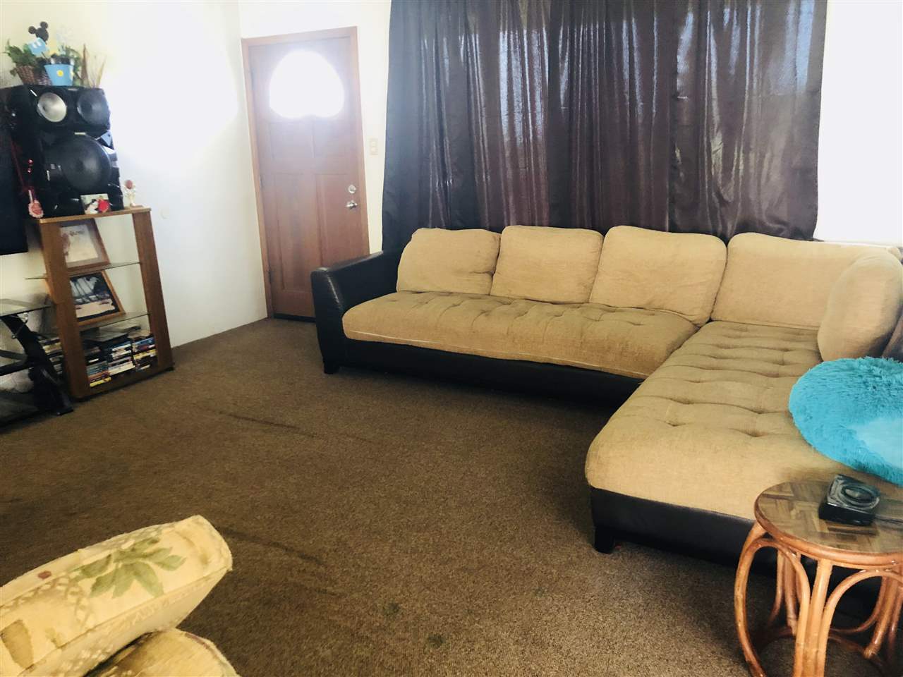 1752 West Kuiaha Road Haiku, HI 96708 - Photo 14 of 24 a living room with furniture and a couch