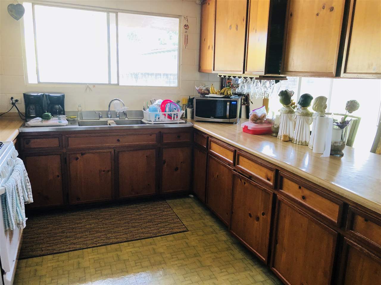 1752 West Kuiaha Road Haiku, HI 96708 - Photo 17 of 24 a kitchen with sink and window