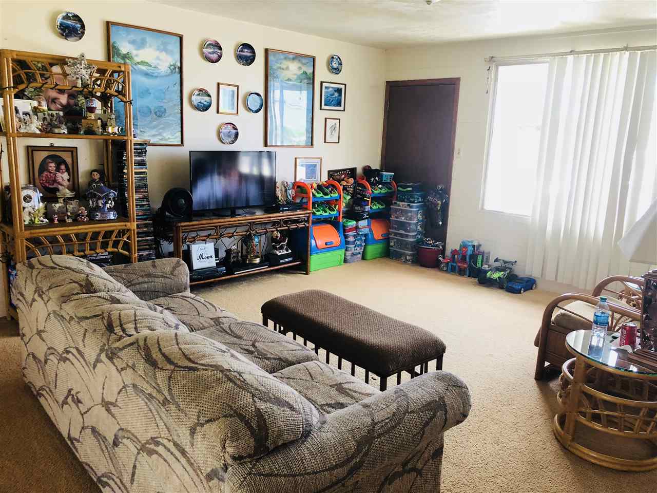1752 West Kuiaha Road Haiku, HI 96708 - Photo 18 of 24 a room with furniture and a flat screen tv