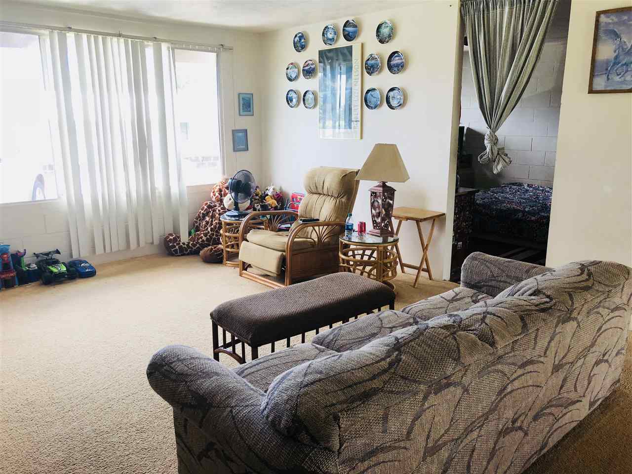 1752 West Kuiaha Road Haiku, HI 96708 - Photo 19 of 24 a living room with furniture and a window