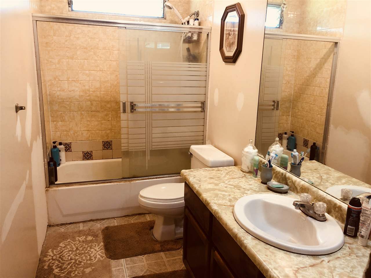 1752 West Kuiaha Road Haiku, HI 96708 - Photo 20 of 24 a bathroom with a sink toilet and shower