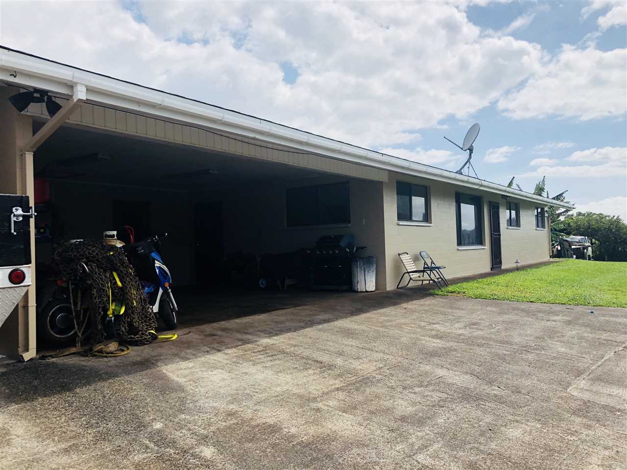 1752 West Kuiaha Road Haiku, HI 96708 - Photo 3 of 24 a view of a house with garage