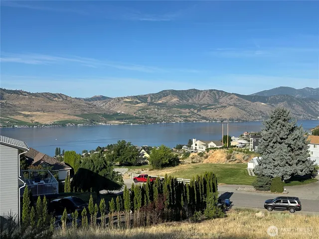 a view of a road with a dry yard