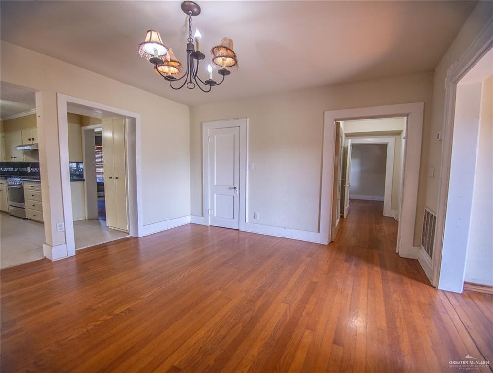 26717 Baker Potts Road Harlingen, TX 78552 - Photo 12 of 18 a view of empty room with wooden floor