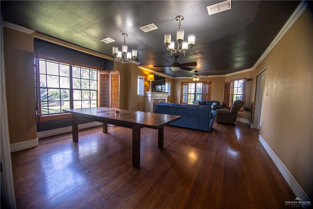 26717 Baker Potts Road Harlingen, TX 78552 - Photo 14 of 18 a living room with furniture and a chandelier