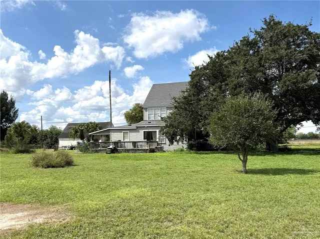 a view of a park with large trees