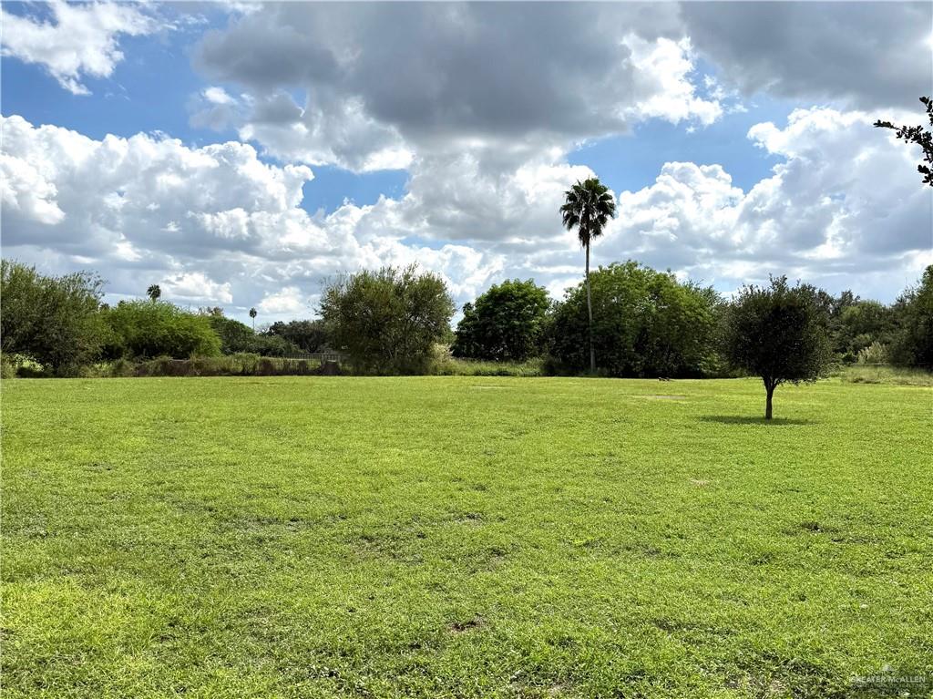 26717 Baker Potts Road Harlingen, TX 78552 - Photo 5 of 18 a view of a golf course with a lake
