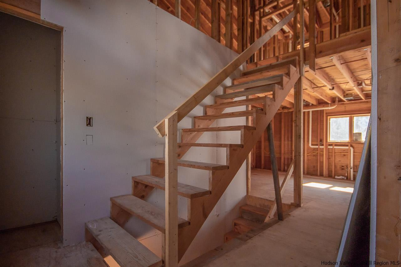59 Markle Road Kerhonkson, NY 12446 - Photo 13 of 24 a view of entryway with wooden floor and stairs