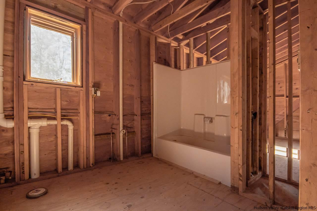59 Markle Road Kerhonkson, NY 12446 - Photo 18 of 24 a bathroom with a tub and shower