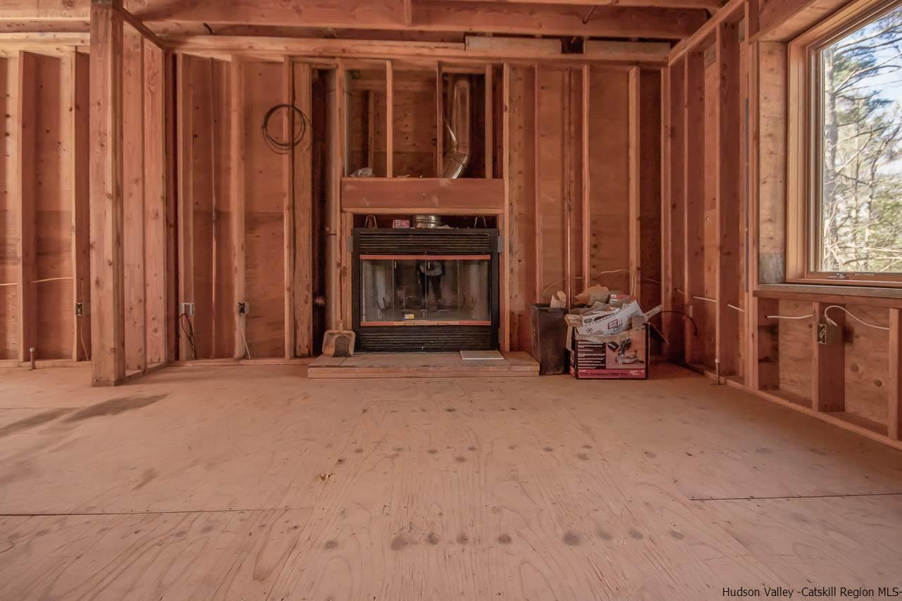 59 Markle Road Kerhonkson, NY 12446 - Photo 5 of 24 a view of a house with porch and furniture