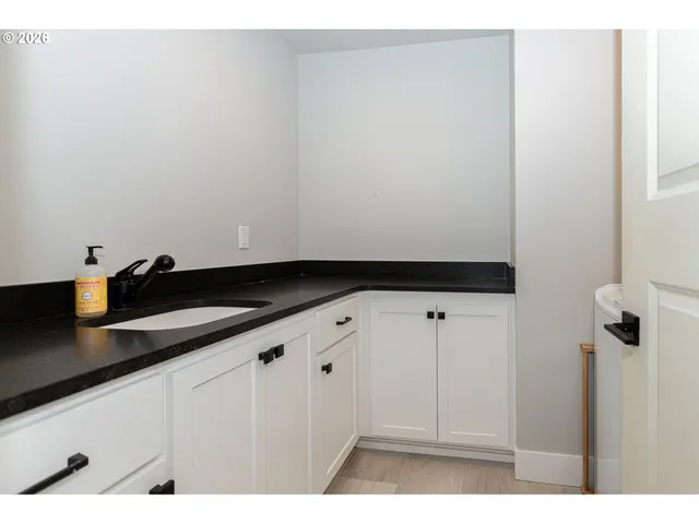 a kitchen with a sink and cabinets