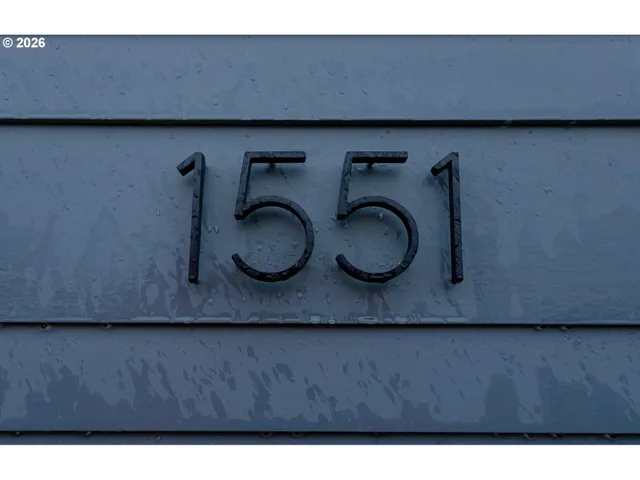 a black and white kitchen with a sink