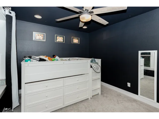 a utility room with cabinets washer and dryer