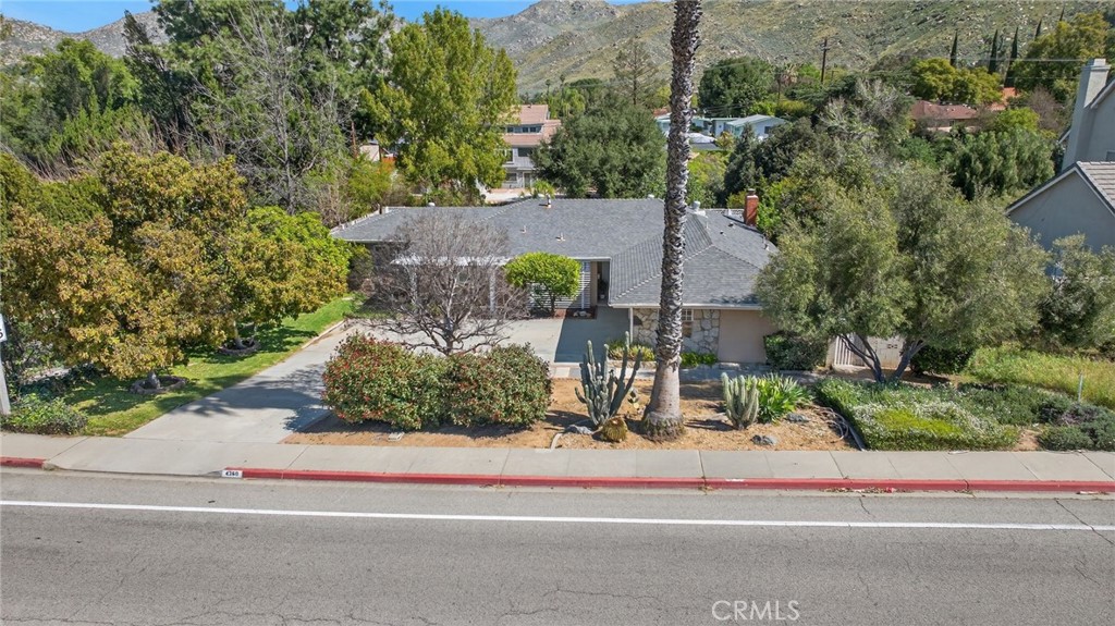 4360 Watkins Drive Riverside, CA 92507 - Photo 1 of 1 an aerial view of a house with a yard and potted plants