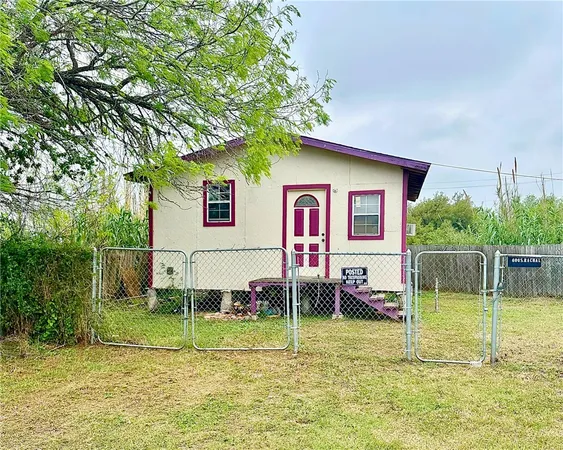 a view of house with backyard