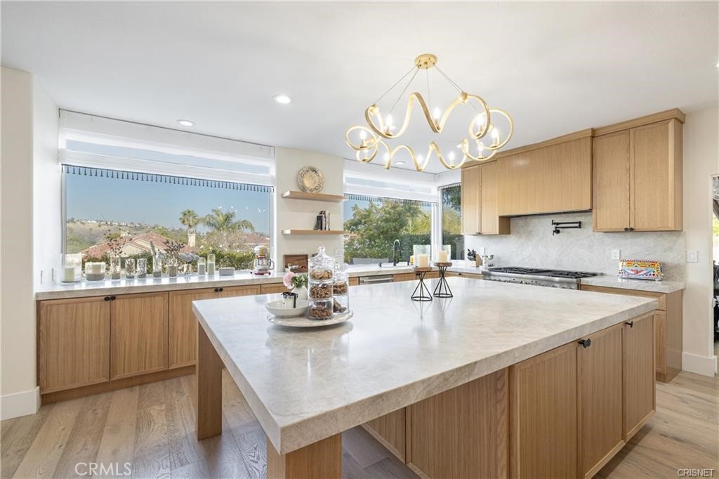 3626 Paseo Primario Calabasas, CA 91302 - Photo 13 of 41 a kitchen with a table chairs and wooden floor