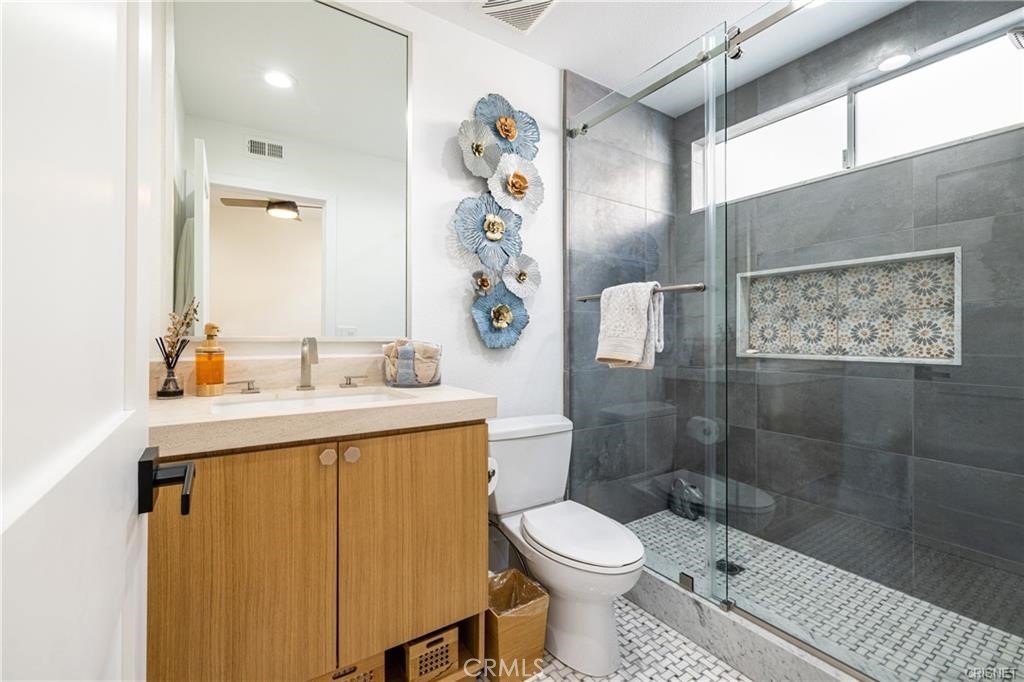3626 Paseo Primario Calabasas, CA 91302 - Photo 16 of 41 a bathroom with a sink toilet and shower