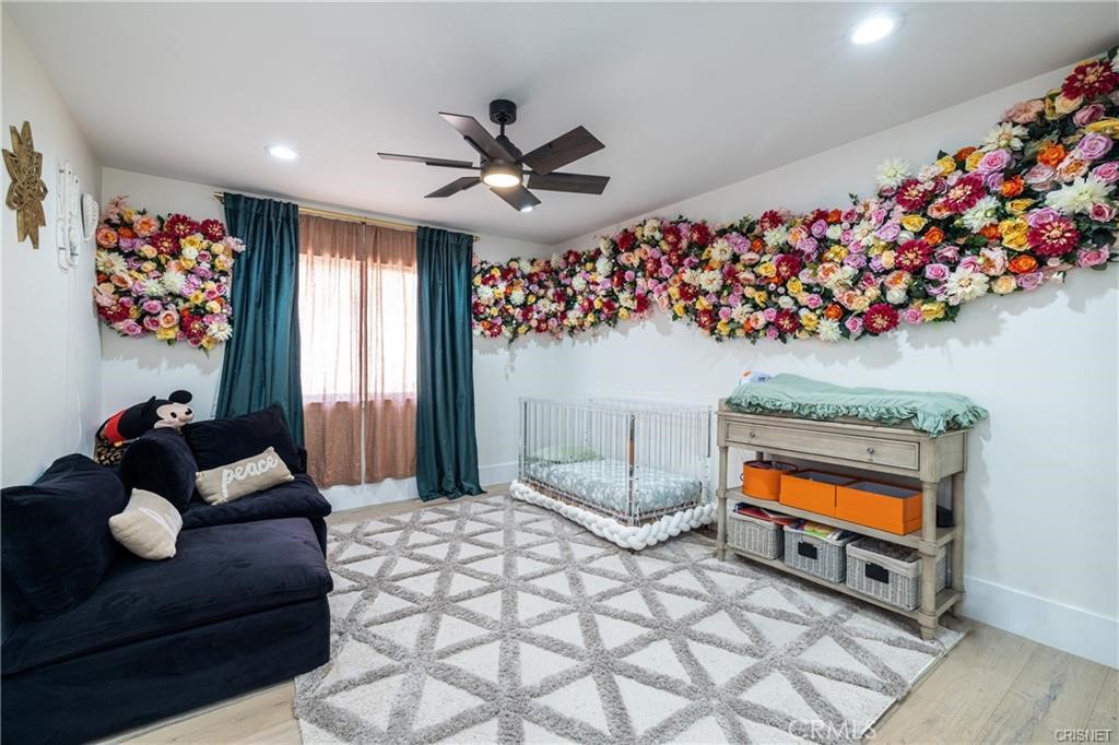 3626 Paseo Primario Calabasas, CA 91302 - Photo 25 of 41 a bedroom with a bed and a chandelier