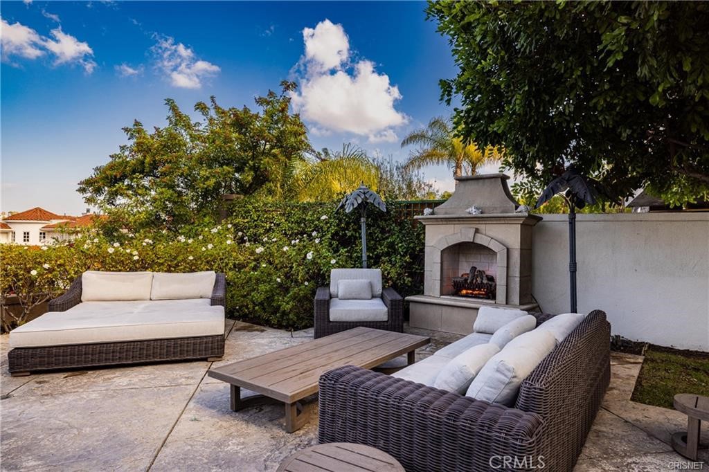 3626 Paseo Primario Calabasas, CA 91302 - Photo 31 of 41 a outdoor space with patio fireplace couches and a fireplace
