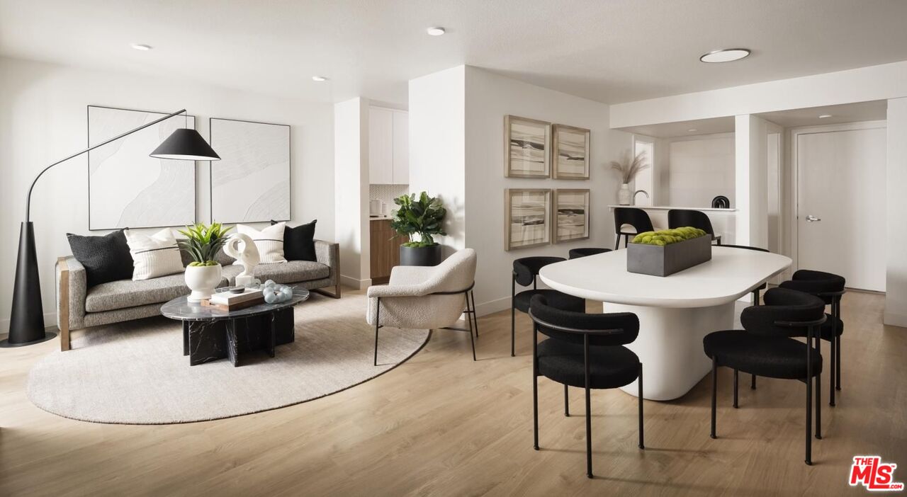 13900 Panay Way, Unit M125 Marina del Rey, CA 90292 - Photo 4 of 23 a living room with furniture and a table