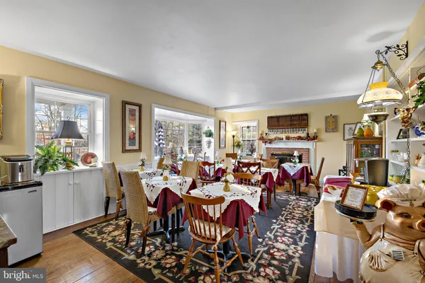 a view of entryway dining room and hall with wooden floor