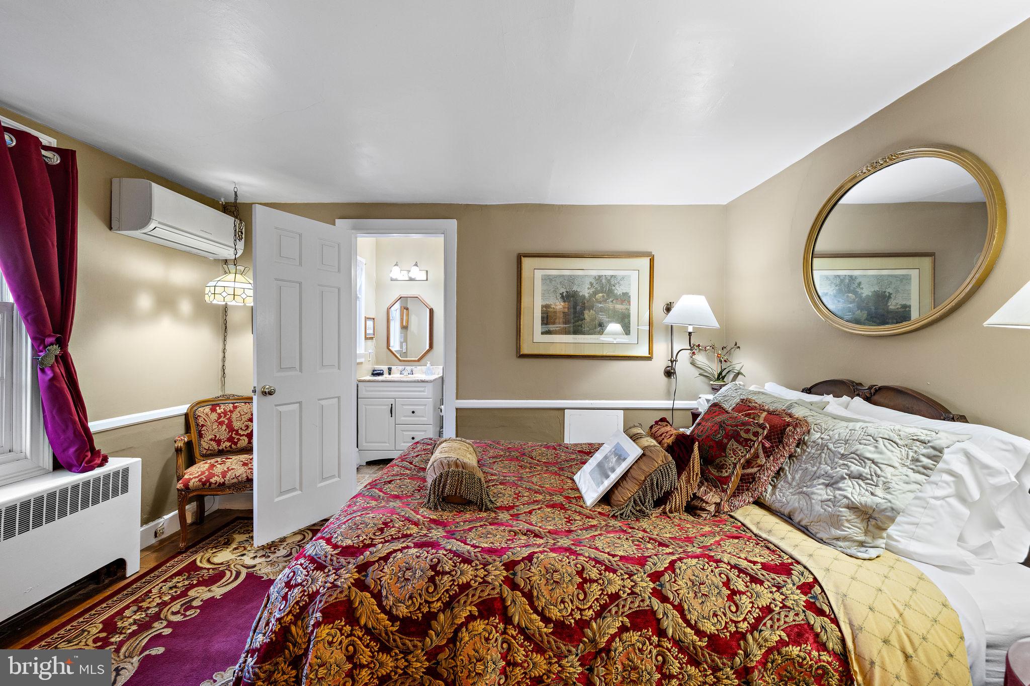 1324 River Road New Hope, PA 18938 - Photo 27 of 70 a bedroom with a bed and a painting on the wall