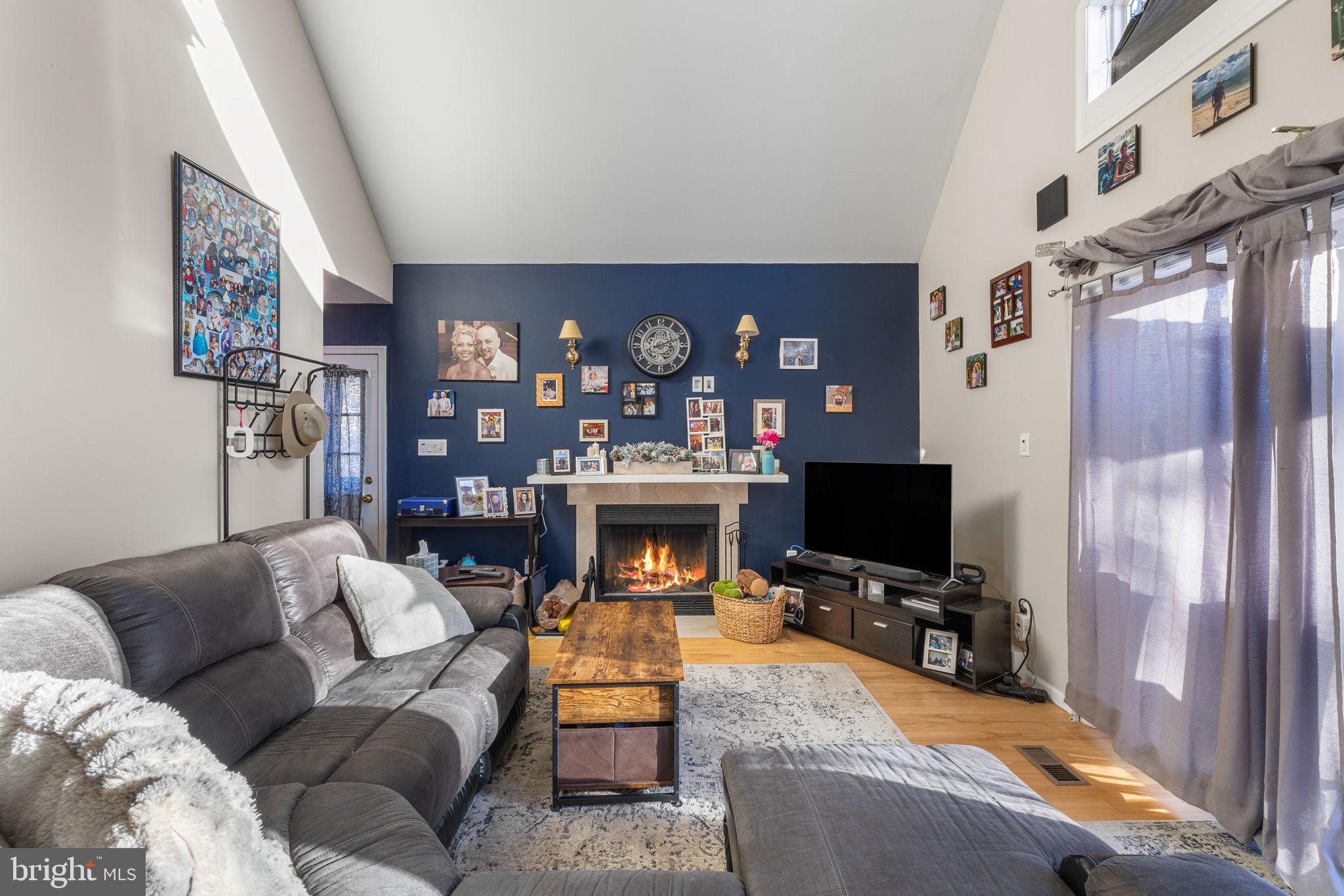 1324 River Road New Hope, PA 18938 - Photo 48 of 70 a living room with furniture a flat screen tv and a fireplace