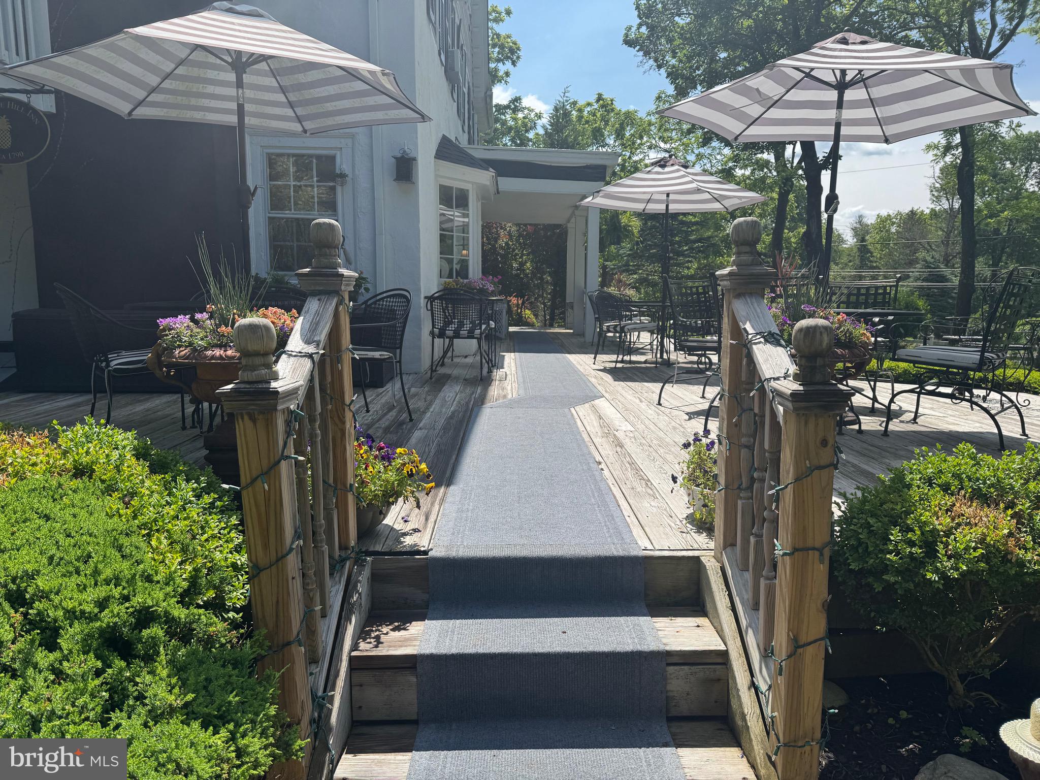 1324 River Road New Hope, PA 18938 - Photo 69 of 70 a view of a patio with table and chairs under an umbrella