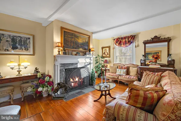a living room with furniture fireplace and a flat screen tv