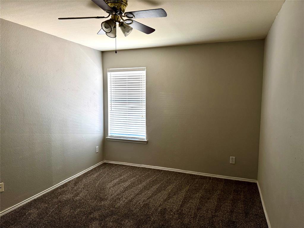 3433 Ingram Road Sachse, TX 75048 - Photo 21 of 23 a view of an empty room with a window