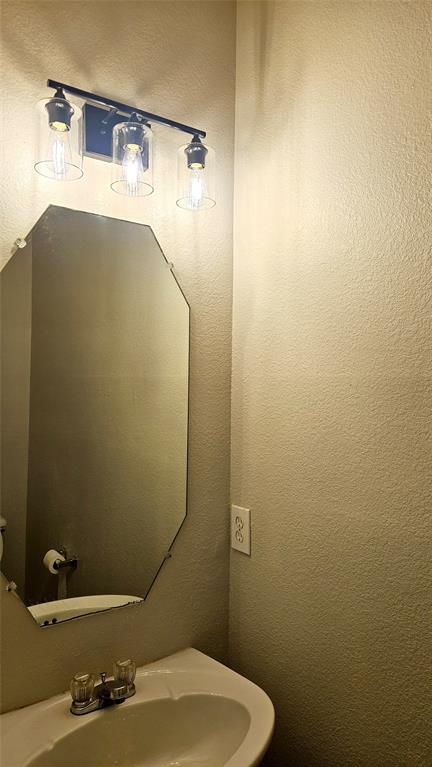 3433 Ingram Road Sachse, TX 75048 - Photo 22 of 23 a bathroom with a sink and toilet