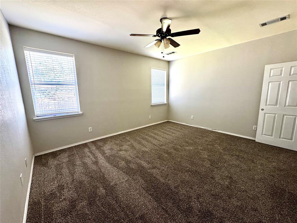 3433 Ingram Road Sachse, TX 75048 - Photo 9 of 23 a view of an empty room with a window