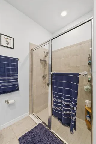 a bathroom with a shower and a sink