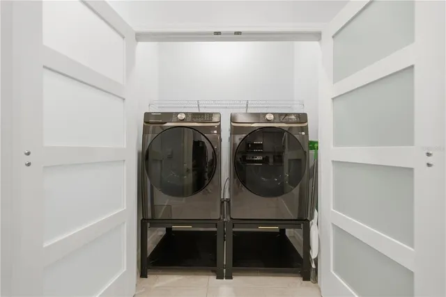 a utility room with dryer and washer