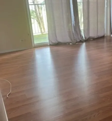 a view of room with window and hardwood