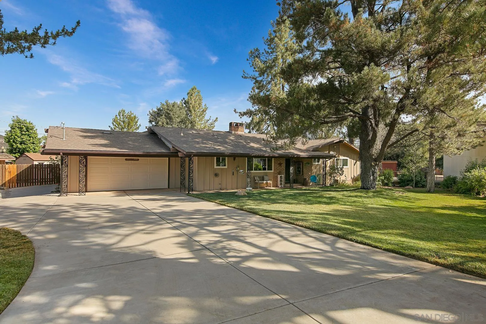 28710 Lone Pine Trail Pine Valley, CA 91962 - Photo 1 of 46 a front view of a house with a garden and trees