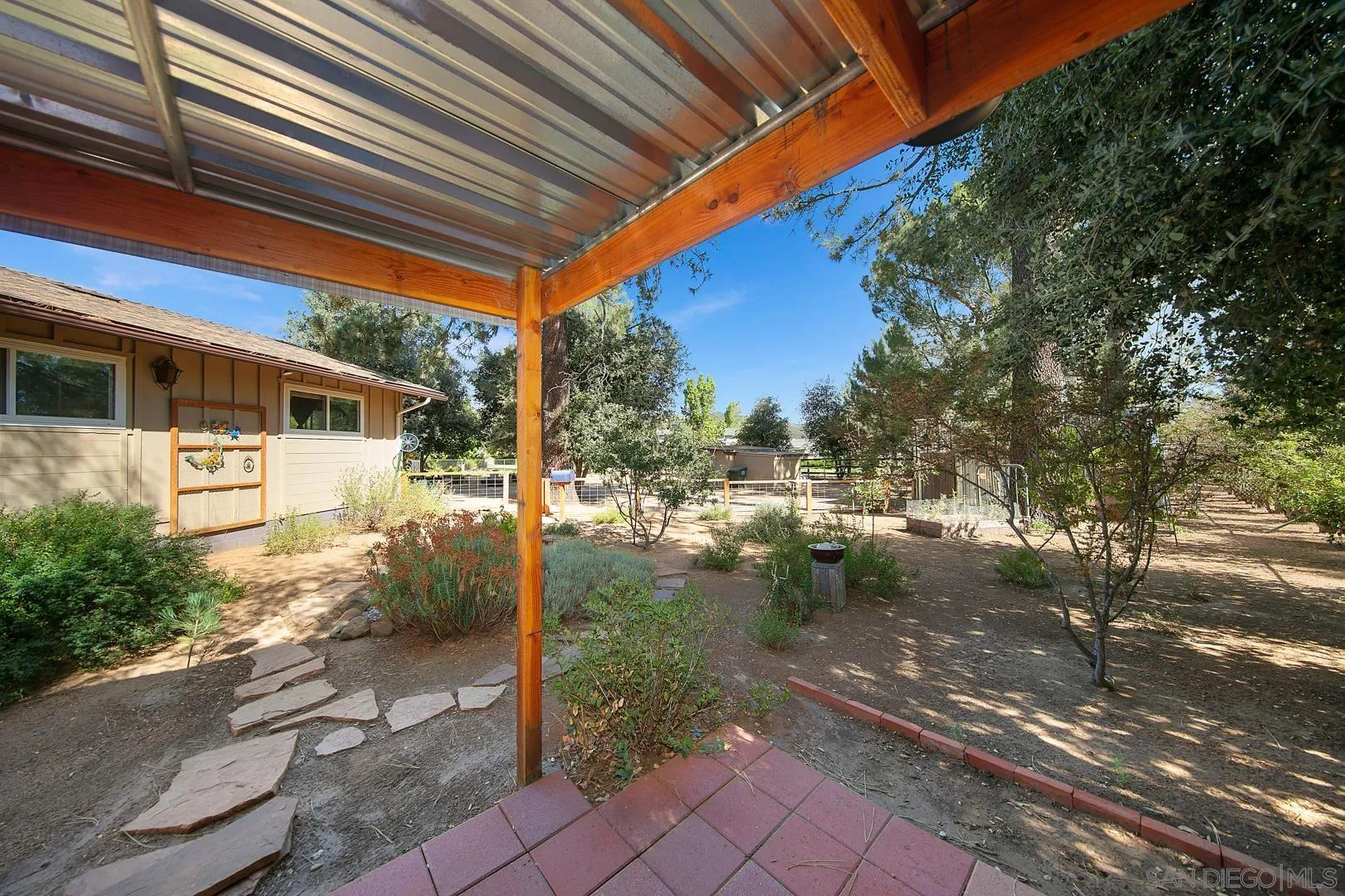 28710 Lone Pine Trail Pine Valley, CA 91962 - Photo 40 of 46 a backyard of a house with a lake view