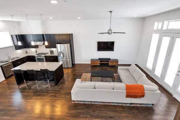 a living room with furniture and a flat screen tv