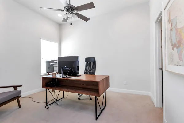 a view of a workspace with furniture